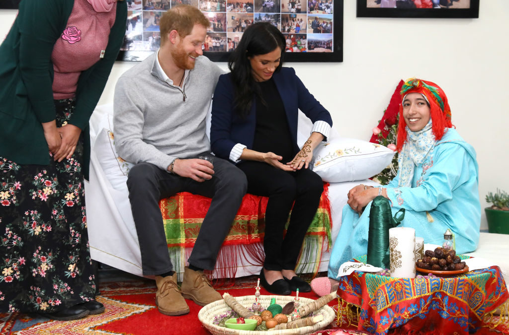 ASNI, MOROCCO - FEBRUARY 24: Prince Harry, Duke of Sussex and Meghan, Duchess of Sussex during a Henna ceremony as they visit the "Education For All" boarding house for girls aged 12 to 18 on February 24, 2019 in Asni, Morocco. "Education For All" ensures that girls from rural communities in the High Atlas Mountain regions have access to secondary education. (Photo by Tim P. Whitby - Pool/Getty Images)