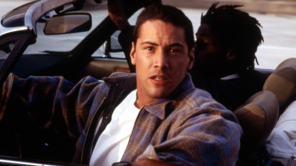 Vajon meg tudja menteni ez az elszánt képű fickó a száguldó busz utasait? Meg hát.