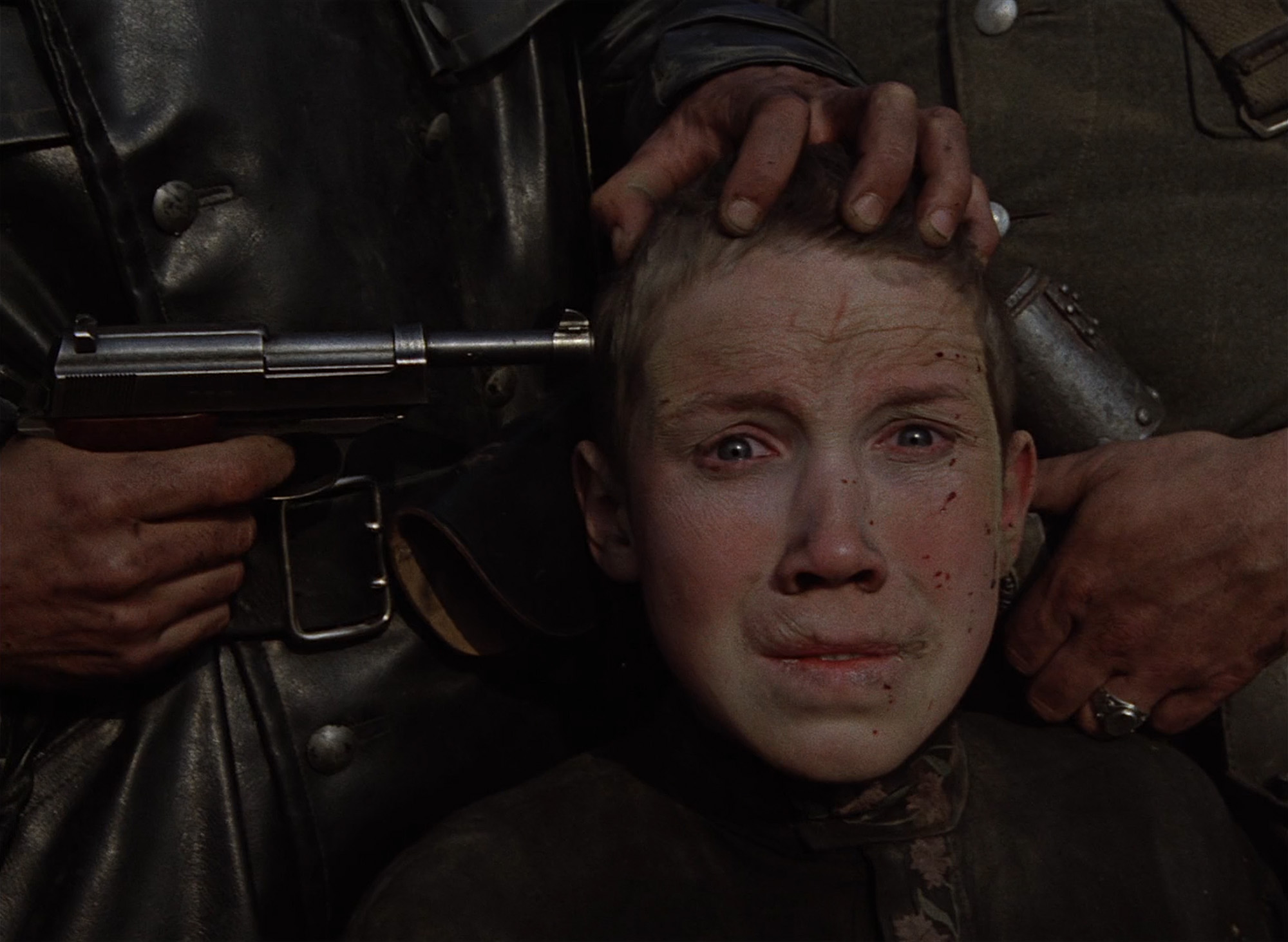 Arcok a Jöjj és lásd! című filmből