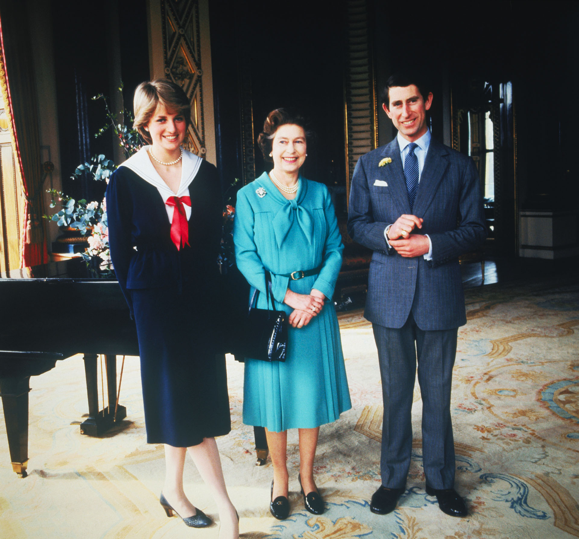 Lady Diana Spencer and Prince Charles pose with Queen Elizabeth at Buckingham Palace, London, in March 1981, the day that their wedding was sanctioned by the Privy Council.