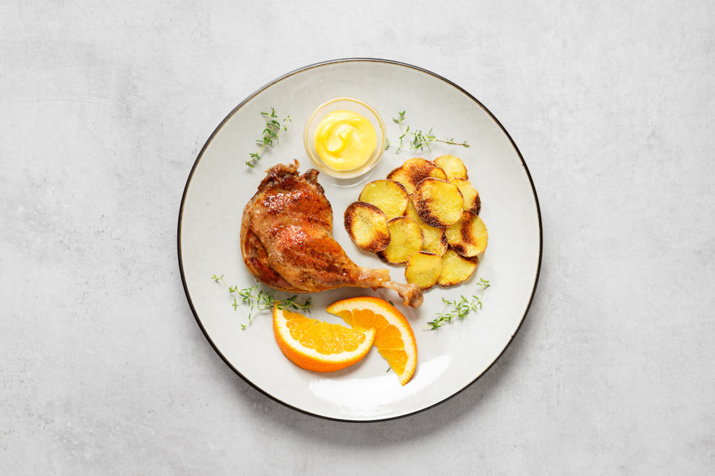 Sült kacsacomb krumplival, narancsszósszal